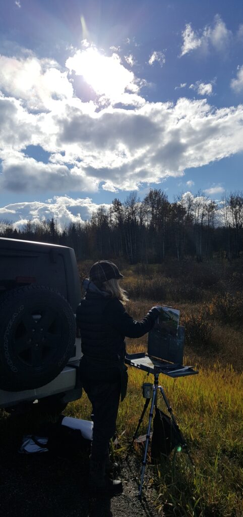Woman oil painting plein air outdoors rocky mountains jeep wrangler